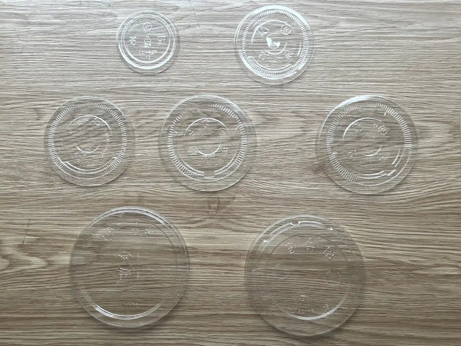 Real photo of transparent clear compostable PLA flat lids